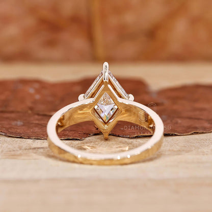 A side profile shot of a gold engagement ring adorned with a captivating lozenge cut diamond, symbolizing eternal love and commitment.