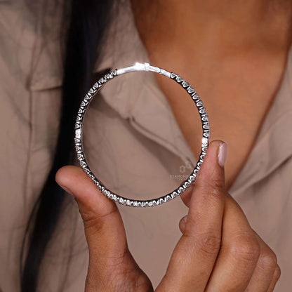 Elegant gold bangle bracelet on a white background