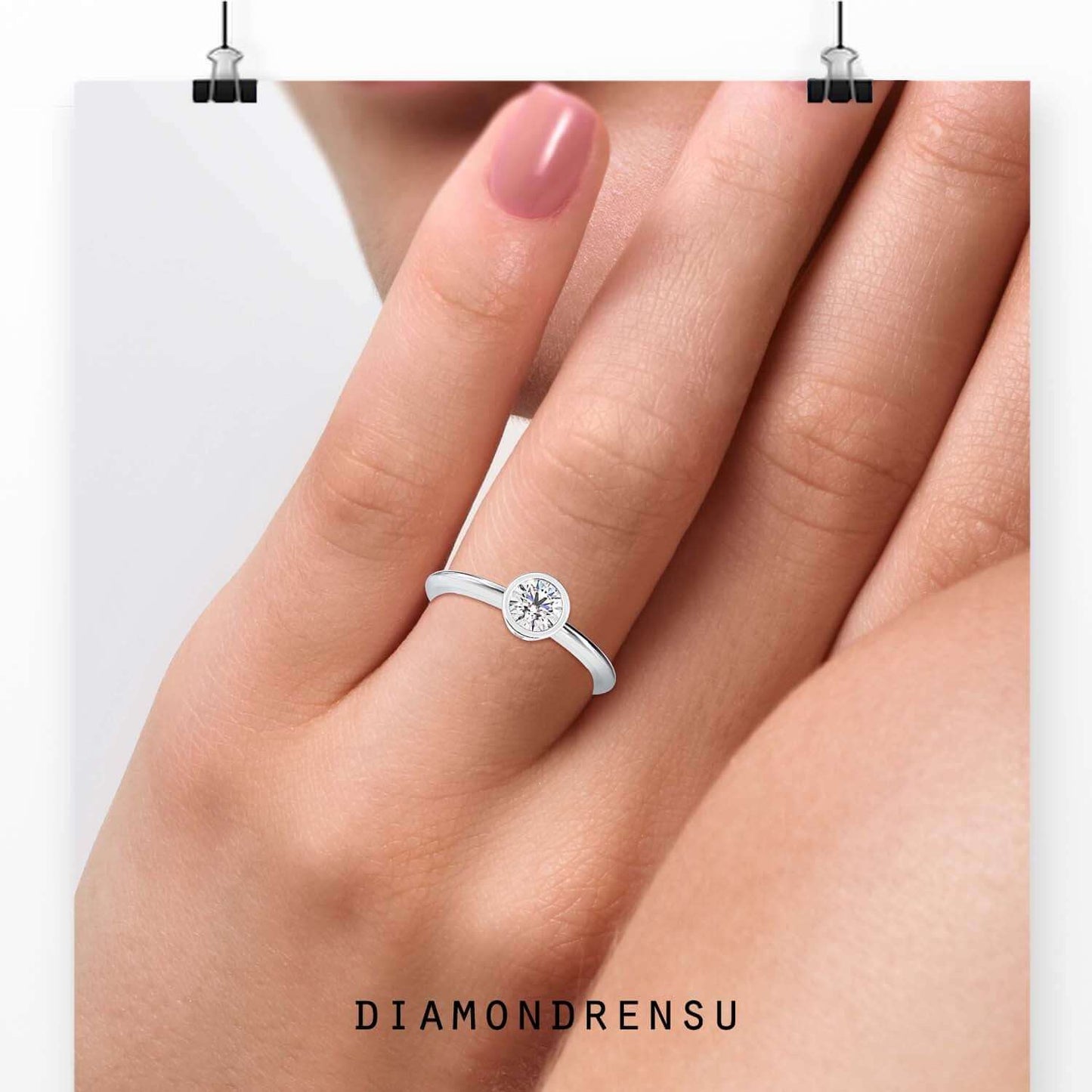 Classic ring setting bezel with a round brilliant cut diamond in a secure setting.
