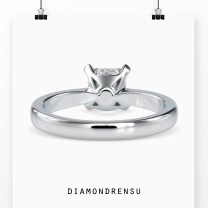 Simple gold ring with princess cut diamond and lab grown diamond accents
