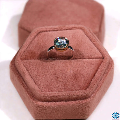 A timeless solitaire engagement ring with a sleek, minimalist design for an understated elegance.
