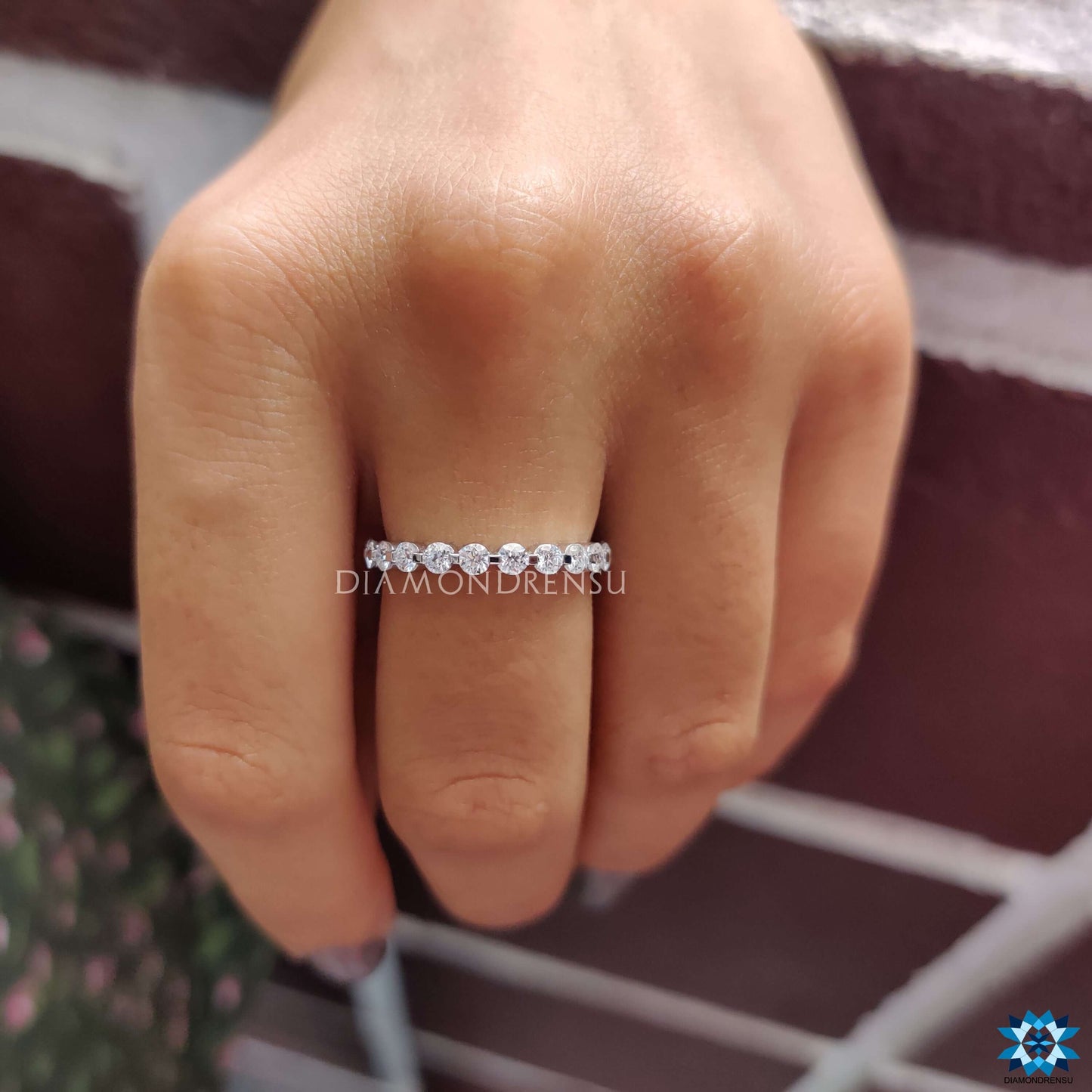 Classic eternity wedding band with sparkling moissanite stones symbolizing endless love.
