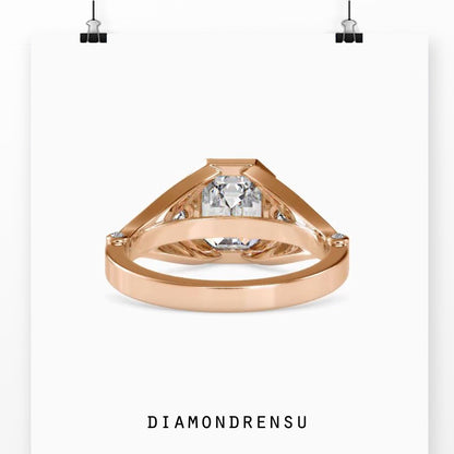 Emerald diamond ring with pear side stones and lab grown diamond

