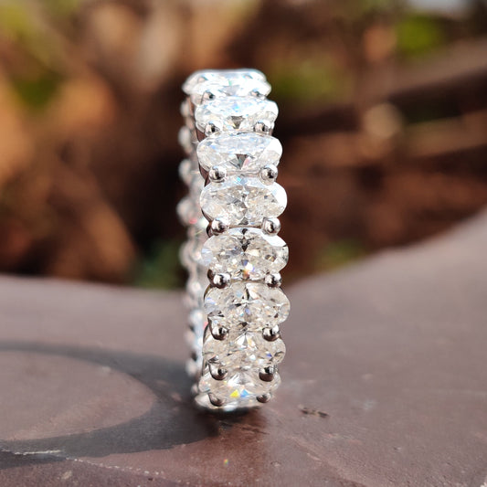 Elegant oval wedding band with a stunning moissanite wedding band design, perfect for lasting love.
