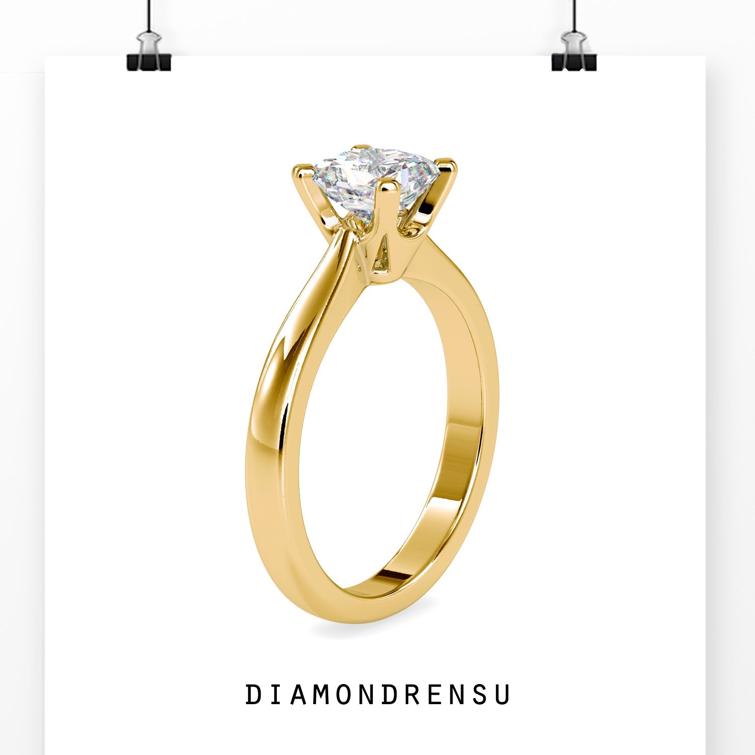 Handmade ring with a diamond solitaire in a tapered shank yellow gold setting
