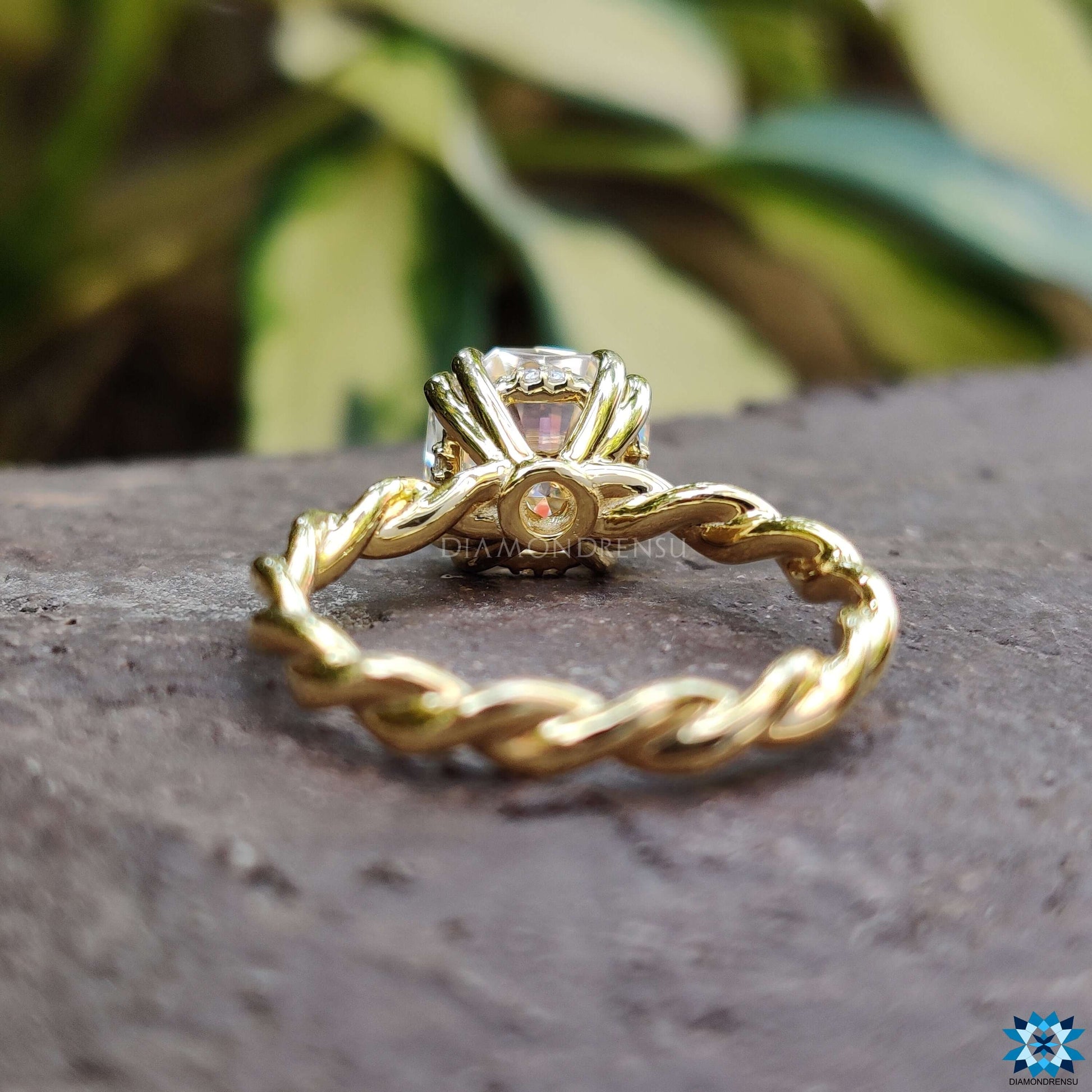 Delicate hidden halo engagement ring showcasing a concealed halo beneath the center diamond for added sparkle.
