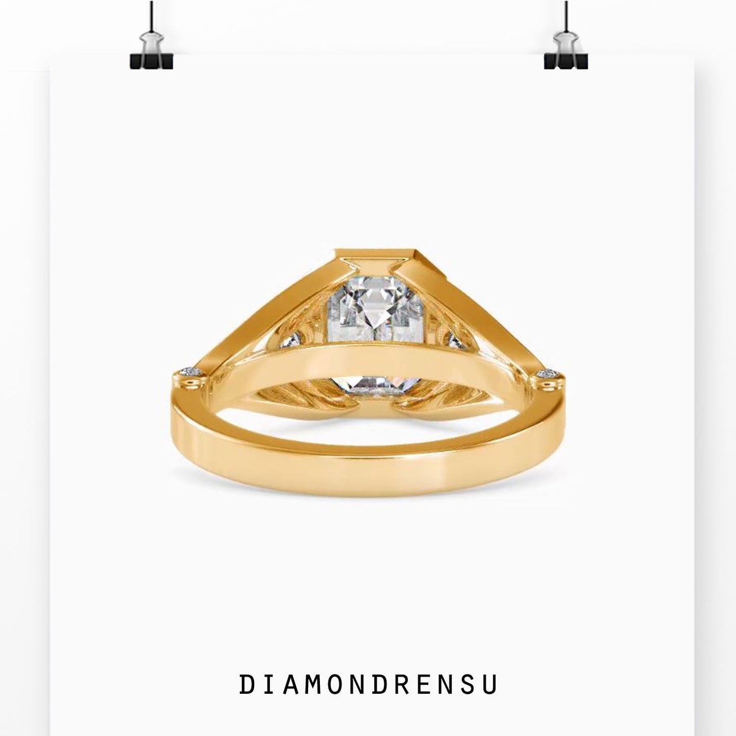 Split shank engagement ring with emerald cut diamond and pave details
