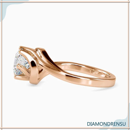 Elegant solitaire engagement ring with a 6 prong bypass setting for extra security.