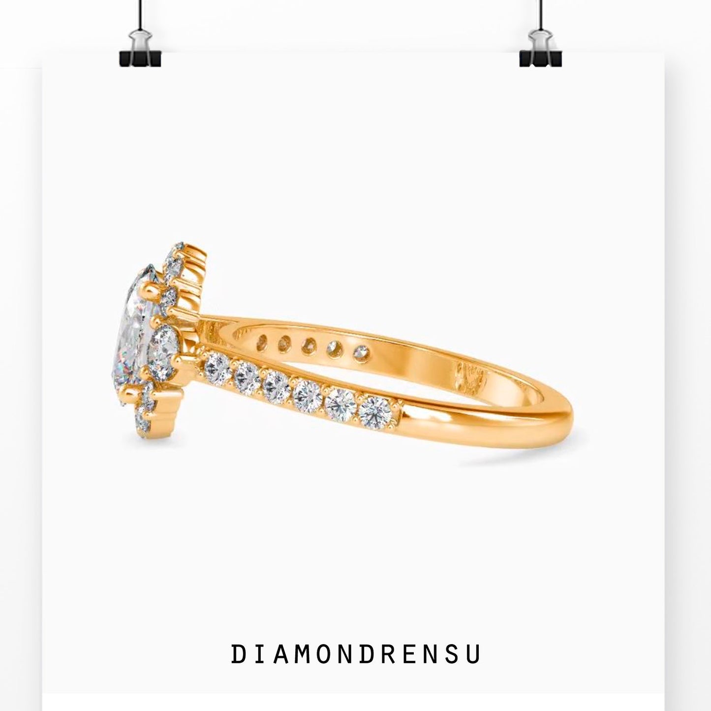 Three stone diamond ring with oval cut center and pave accents
