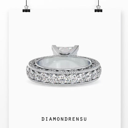 Handmade jewelry featuring a princess cut ring in rose gold.
