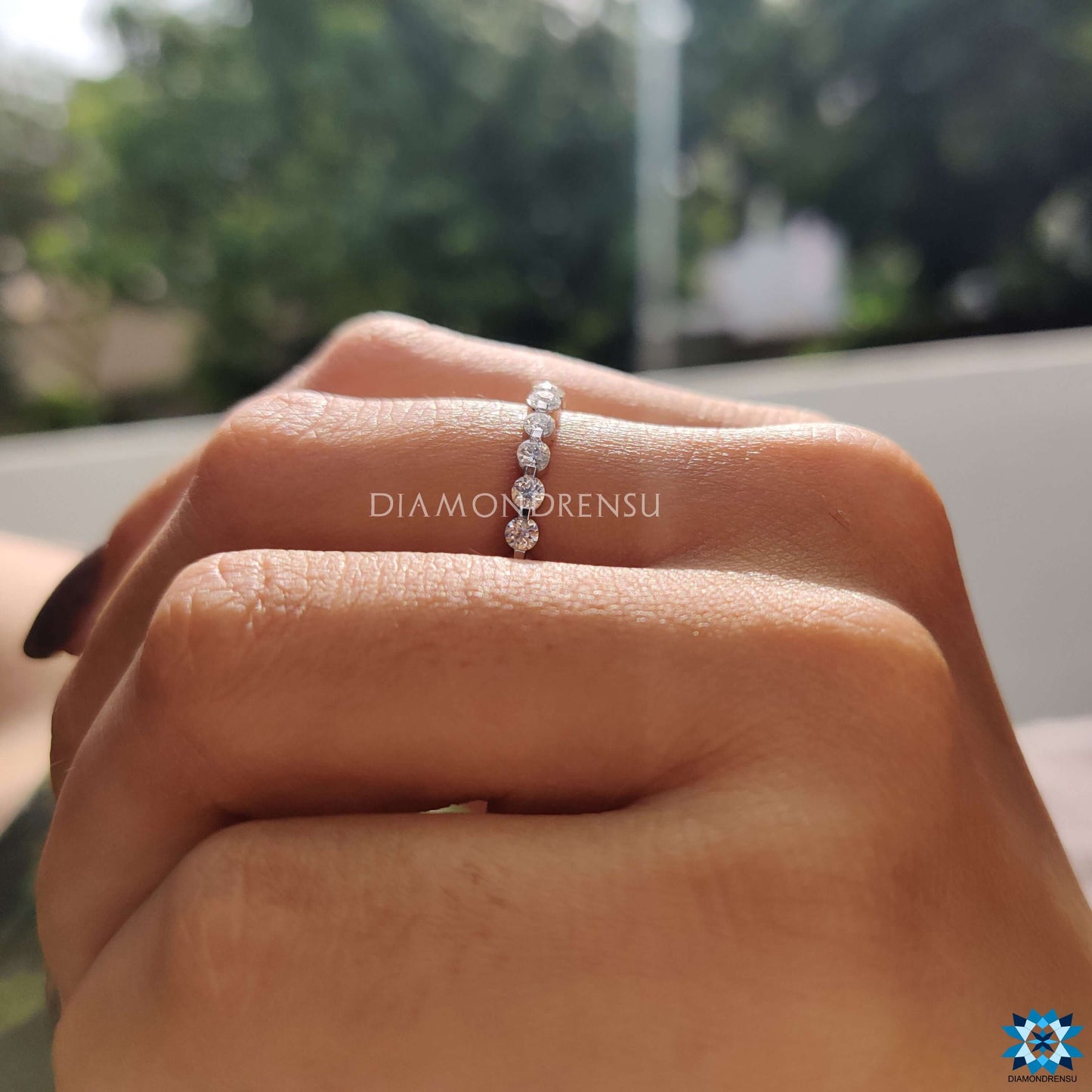 Stunning women's simple wedding band with a sleek, minimalist design and brilliant moissanite.
